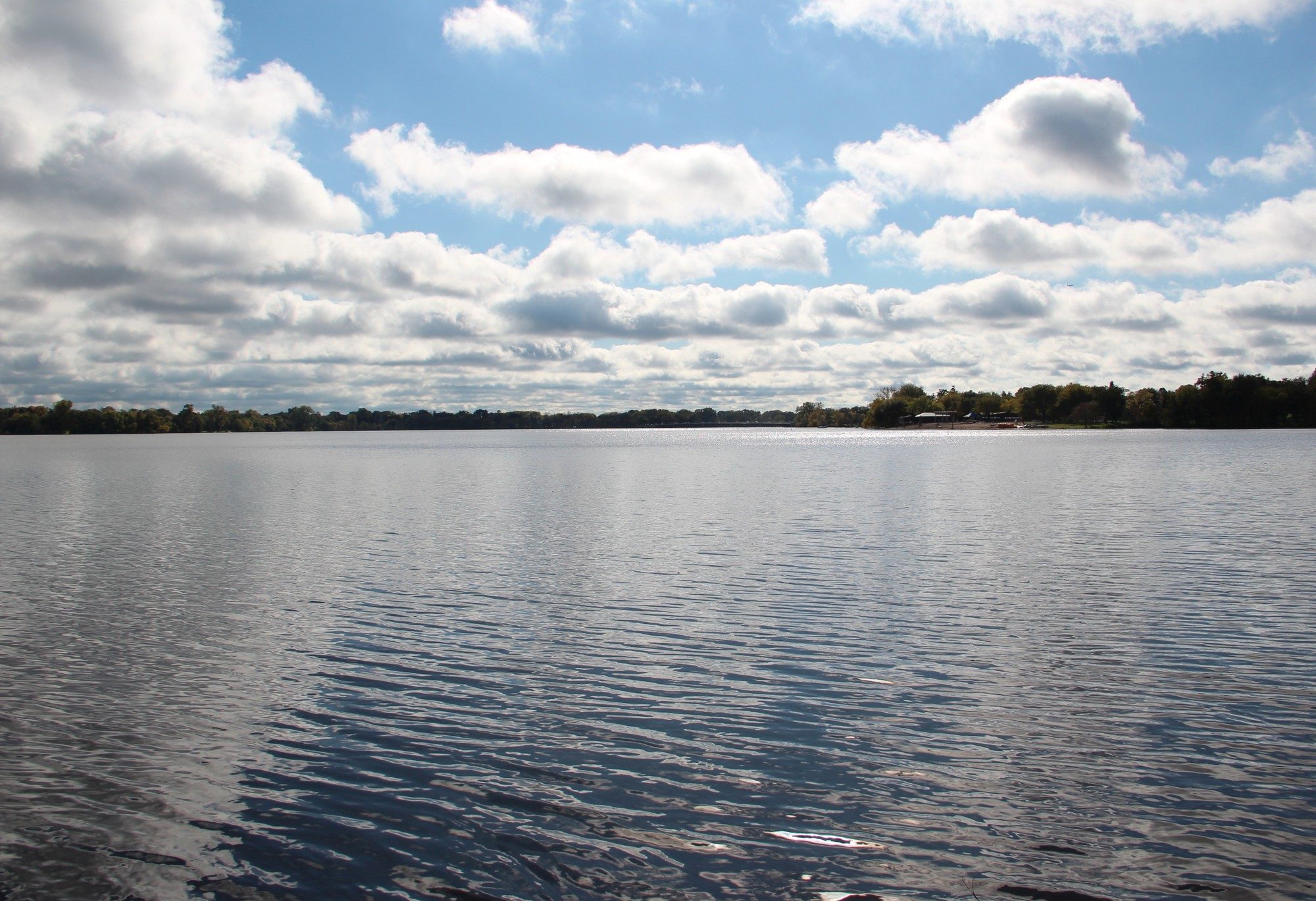 Lake Nokomis in Minneapolis, open water under big clouds